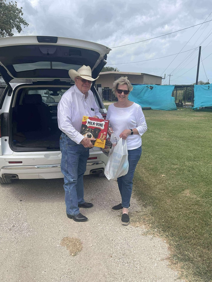 Couple delivering donations in truck