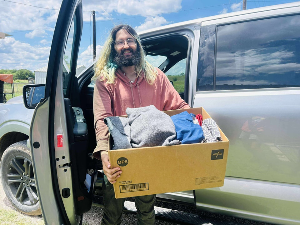 Man donating clothes at event